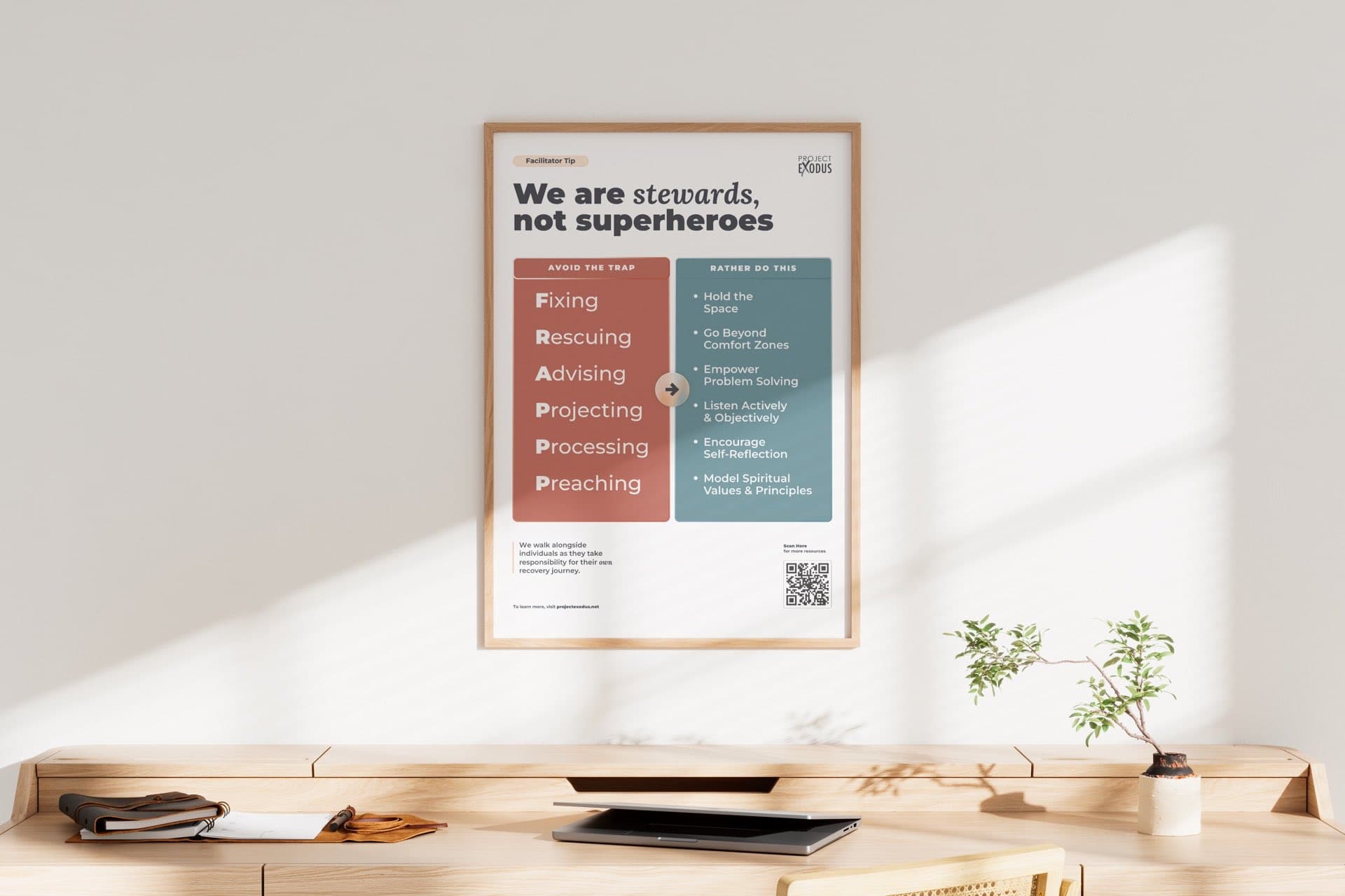A facilitator tip poster framed on a wall above a desk: We are stewards, not superheroes
