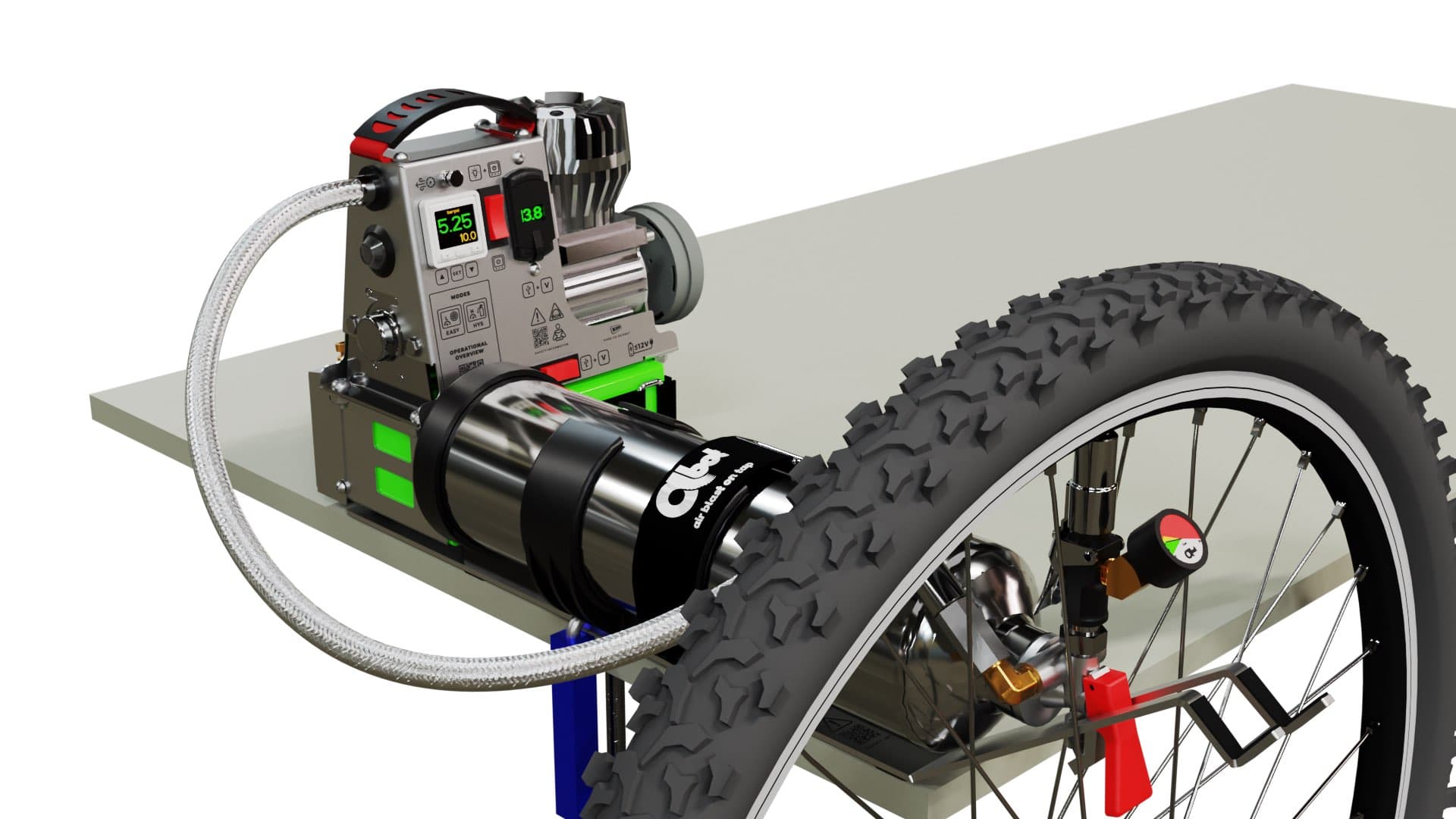 The Pro and the tank docked together at the edge of a workbench, a mountain bike wheel resting against them